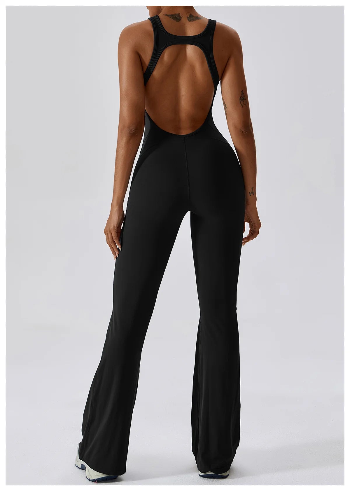 Women’s open back V jumpsuit gym set by The Clothing Company Sydney, featuring a stretch fitness romper for yoga and workout training.