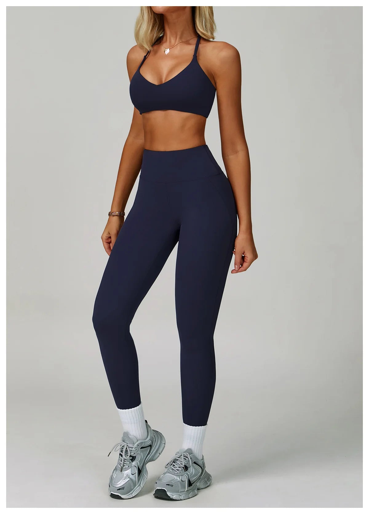 The Clothing Company Sydney women's 2-piece fitness tracksuit with high waist leggings and sports bra, ideal for yoga and workout sessions.