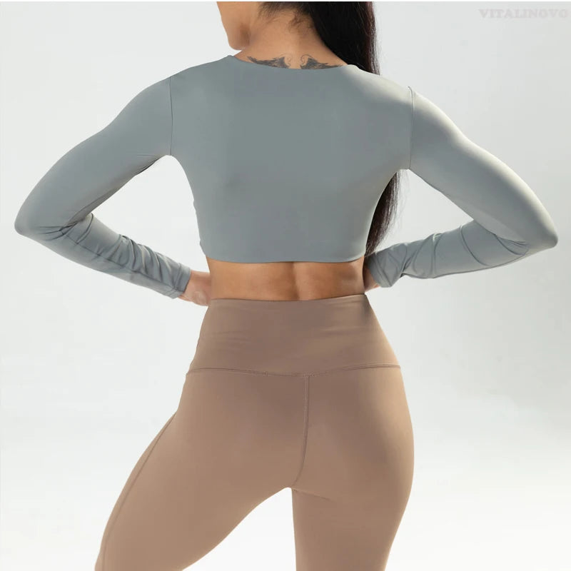 Long sleeve fitness crop top by The Clothing Company Sydney with twist design, deep V neckline, quick-dry fabric, padded for support