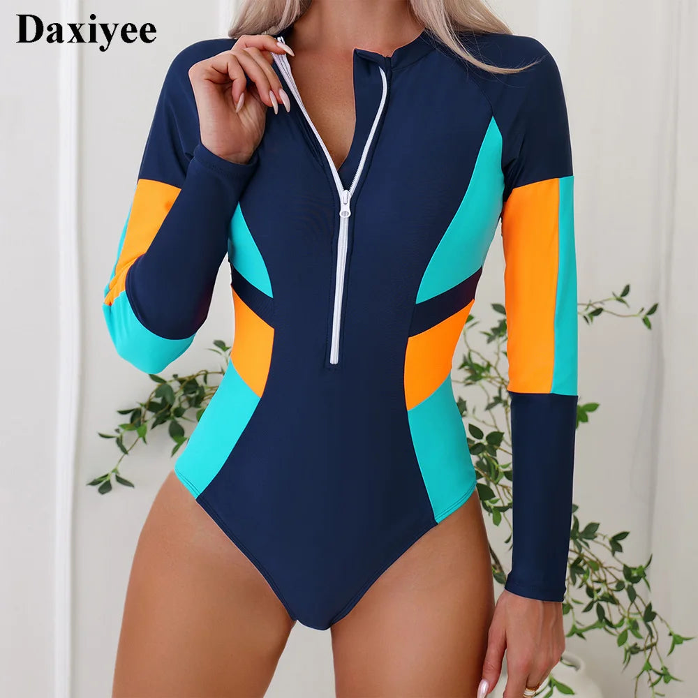 Contrast color one-piece swimsuit with long sleeves, patchwork design, high elasticity, ideal for surfing and beachwear.