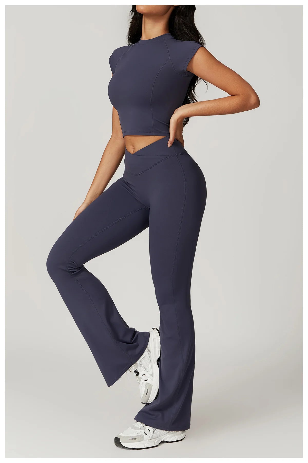 Two-piece women's fitness set with crop top, sports bra, and leggings from The Clothing Company Sydney, designed for yoga and gym workouts.