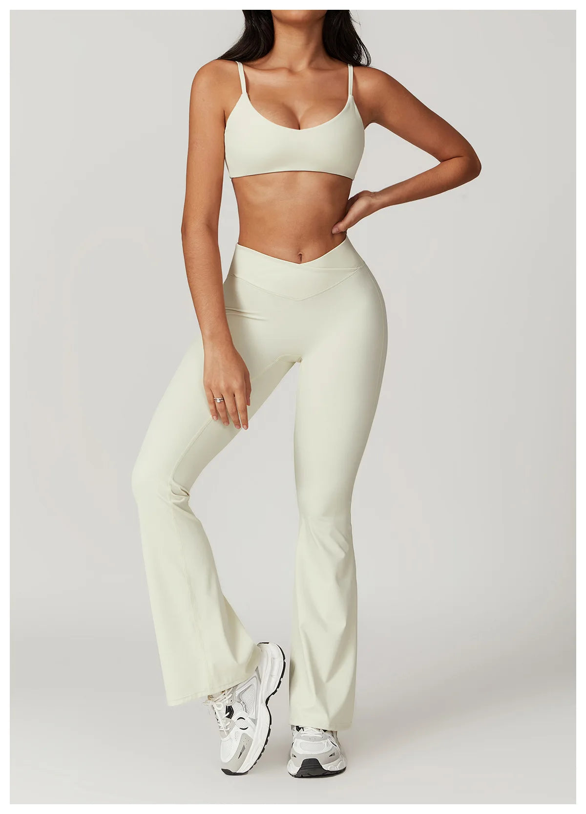 Two-piece women's fitness set including a short sleeve crop top, sports bra, and leggings from The Clothing Company Sydney.