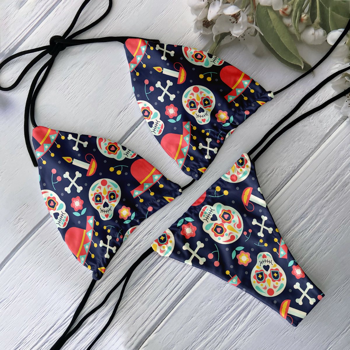Backless 2-piece bikini set for women with skull pattern print, low waist design, perfect for beach surfing and vacation wear.