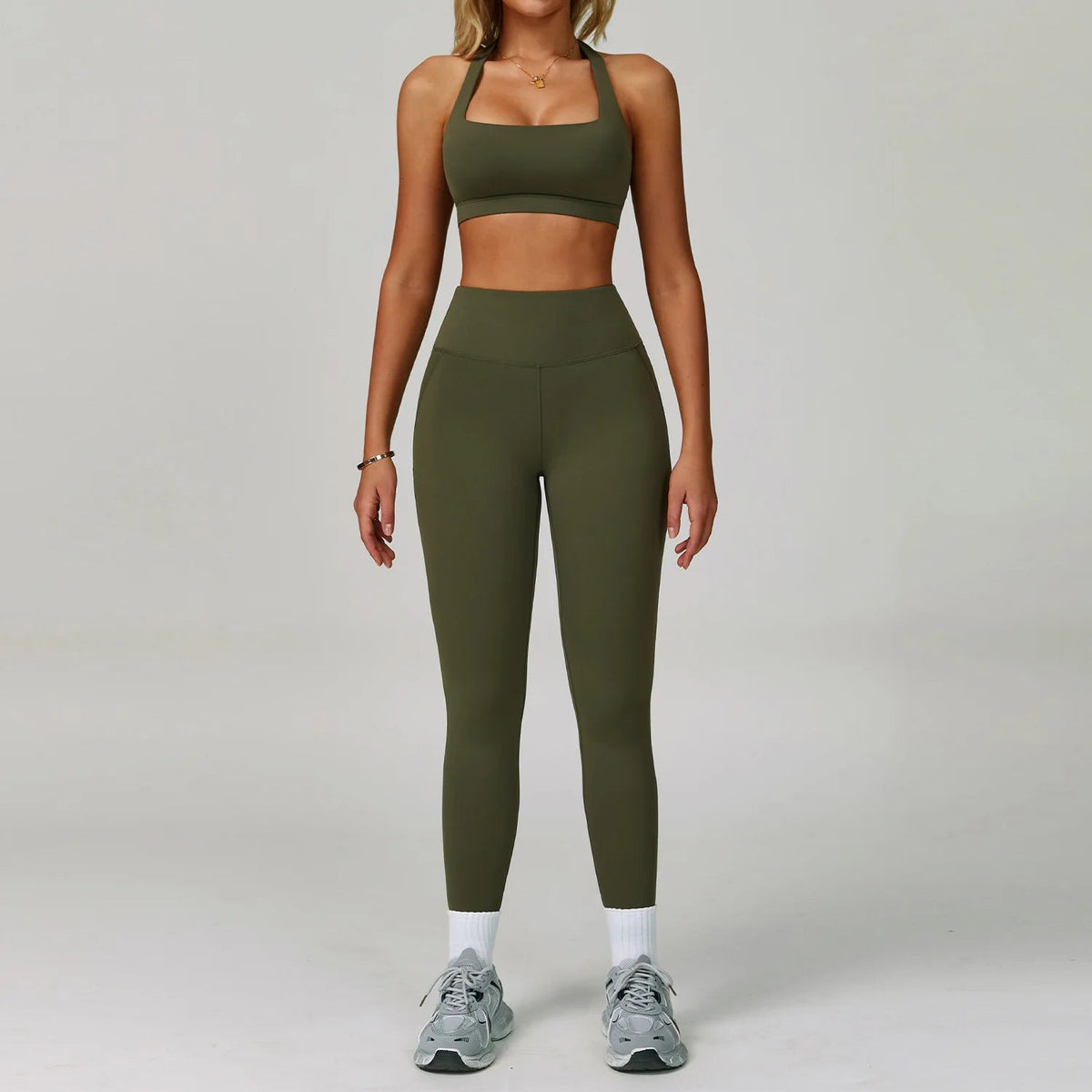 Women's fitness tracksuit set with yoga bra and high waist leggings, by The Clothing Company Sydney, for workout and gym activities.