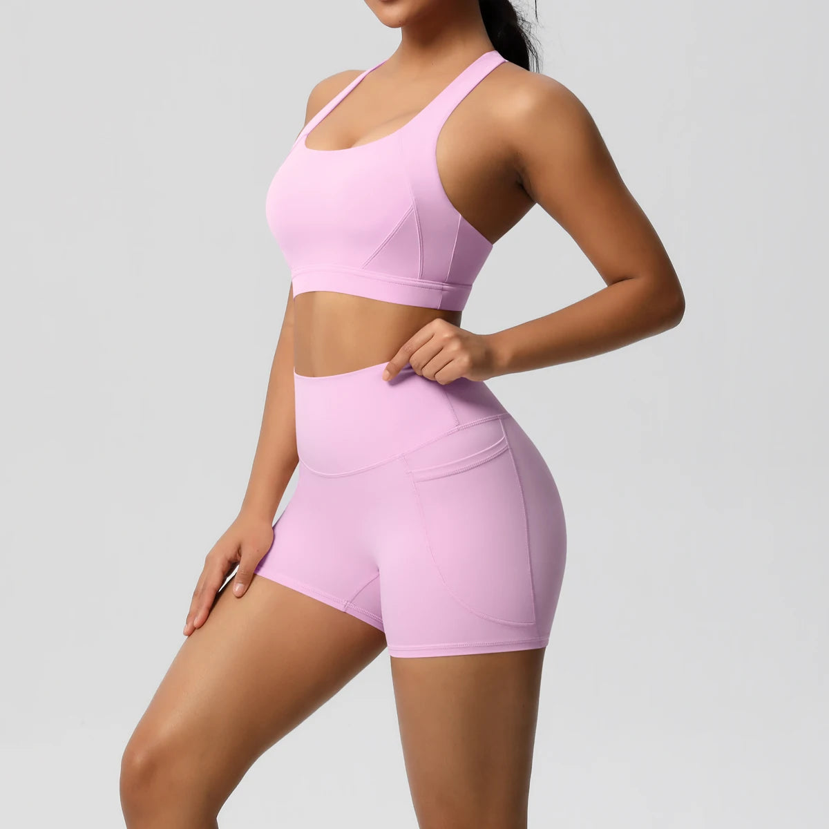 The Clothing Company Sydney women's 2-piece sportswear set with pocketed gym clothes, yoga suits, crossover bra, and leggings.