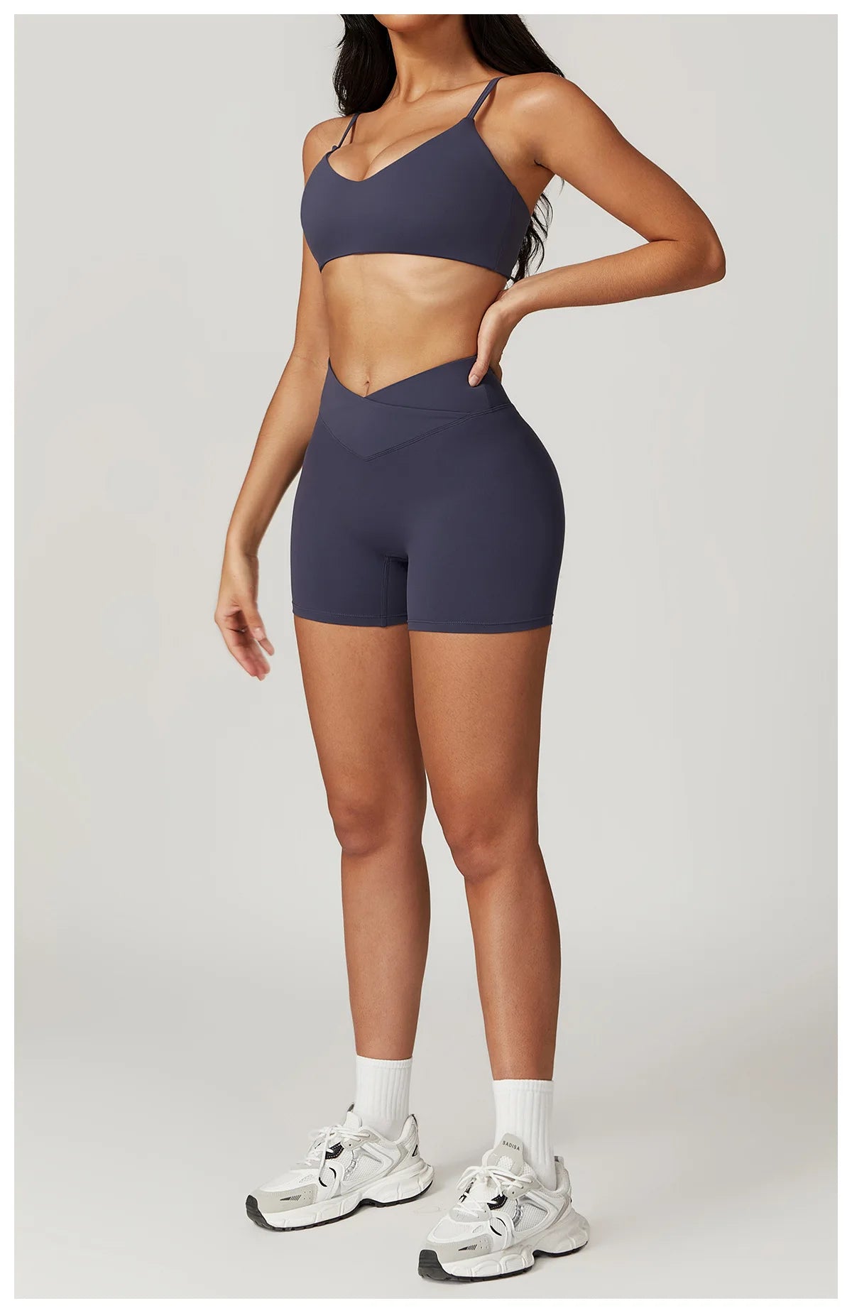 Two-piece women's fitness set including a crop top, sports bra, and leggings from The Clothing Company Sydney, designed for yoga and gym workouts.