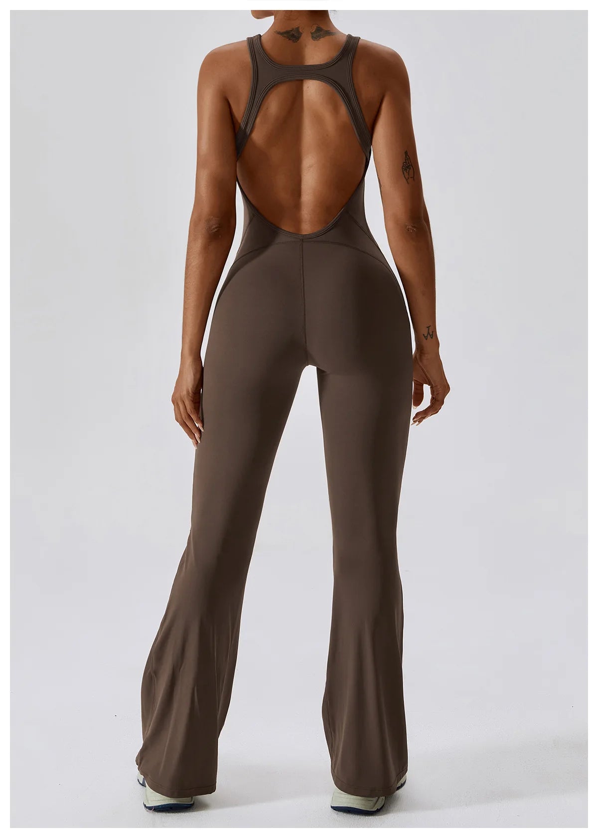 Open back V jumpsuit gym set for women, designed for yoga, fitness, and workouts, featuring stretchy sportswear and bodysuit style.