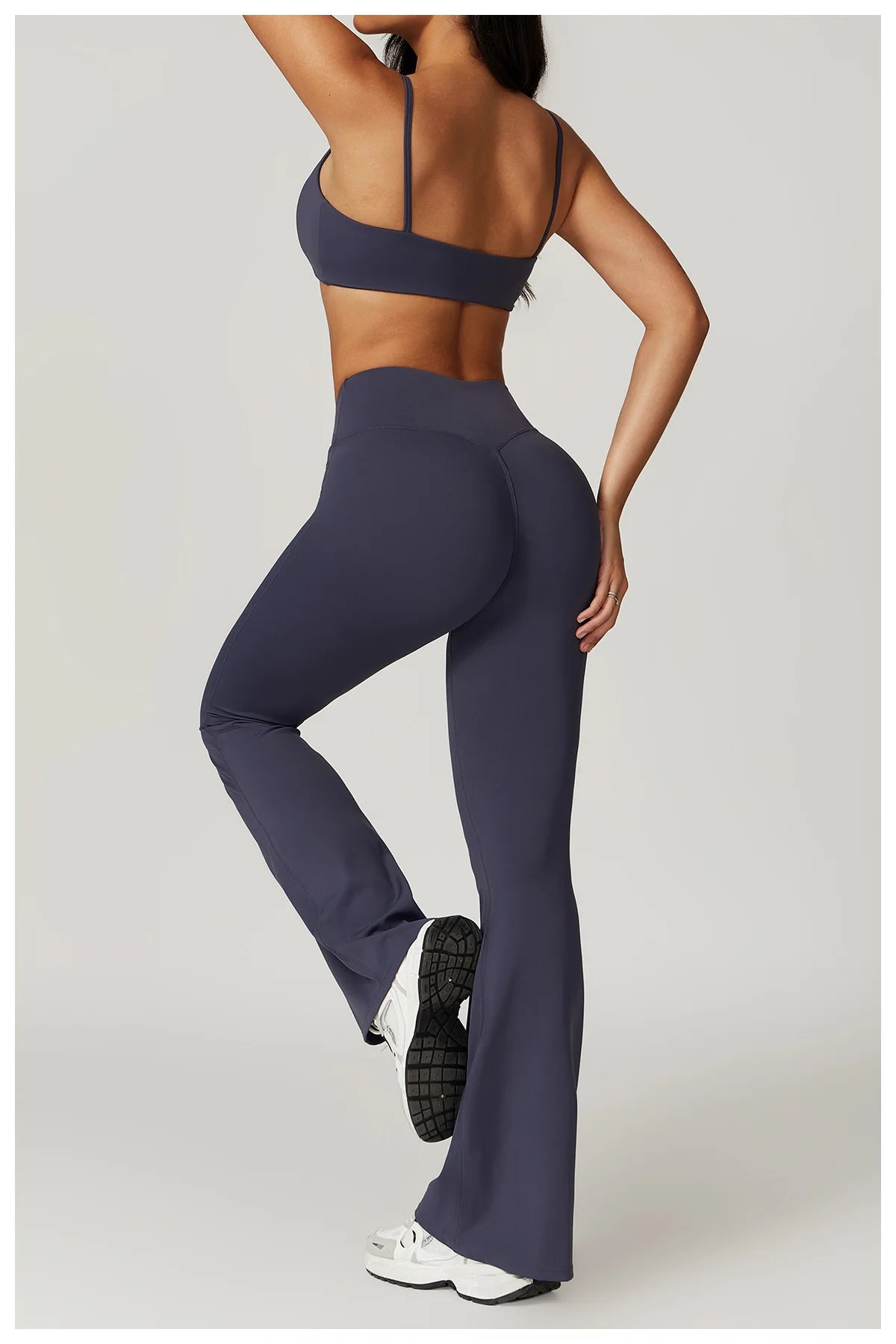 Two-piece women's fitness set with crop top, sports bra, and leggings from The Clothing Company Sydney, ideal for yoga and gym workouts.