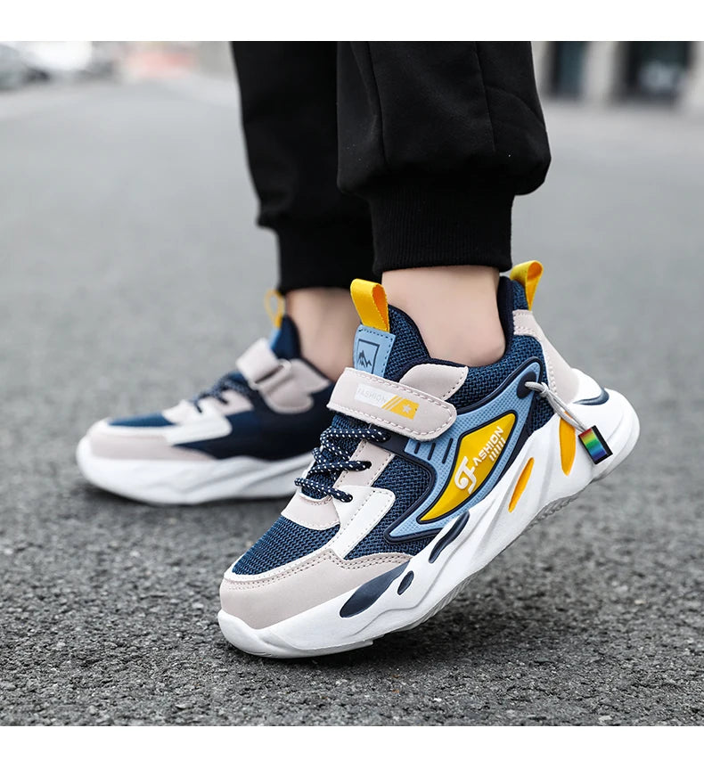 Boys' breathable mesh sneakers by The Clothing Company Sydney showing lightweight sports shoes with non-slip soles and hook & loop closure.