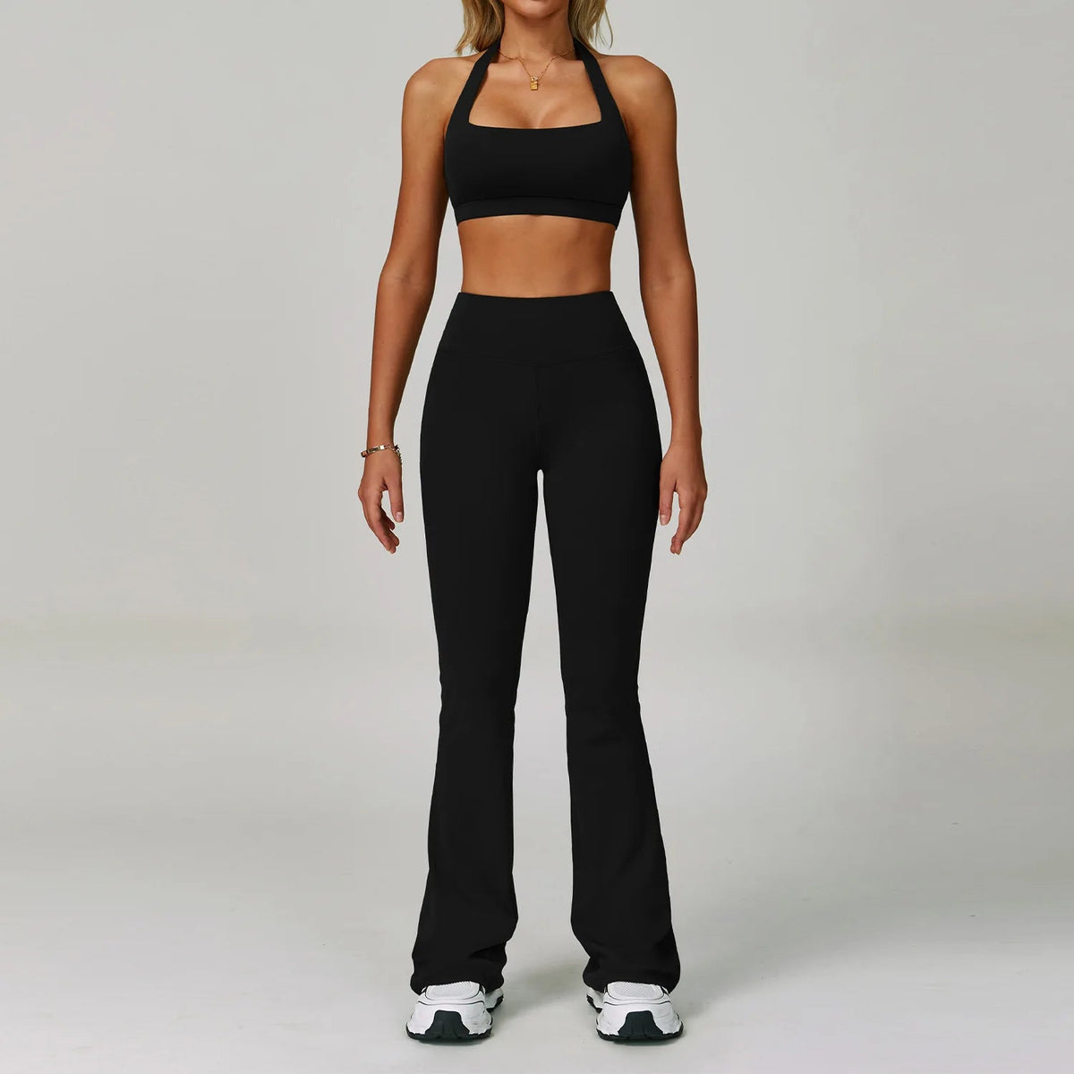 Two-piece women's fitness tracksuit from The Clothing Company Sydney, high waist leggings and workout bra for yoga and gym workouts.
