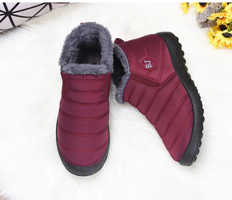 Women’s waterproof fur snow boots by The Clothing Company Sydney, slip-on ankle footwear with cozy fur lining.