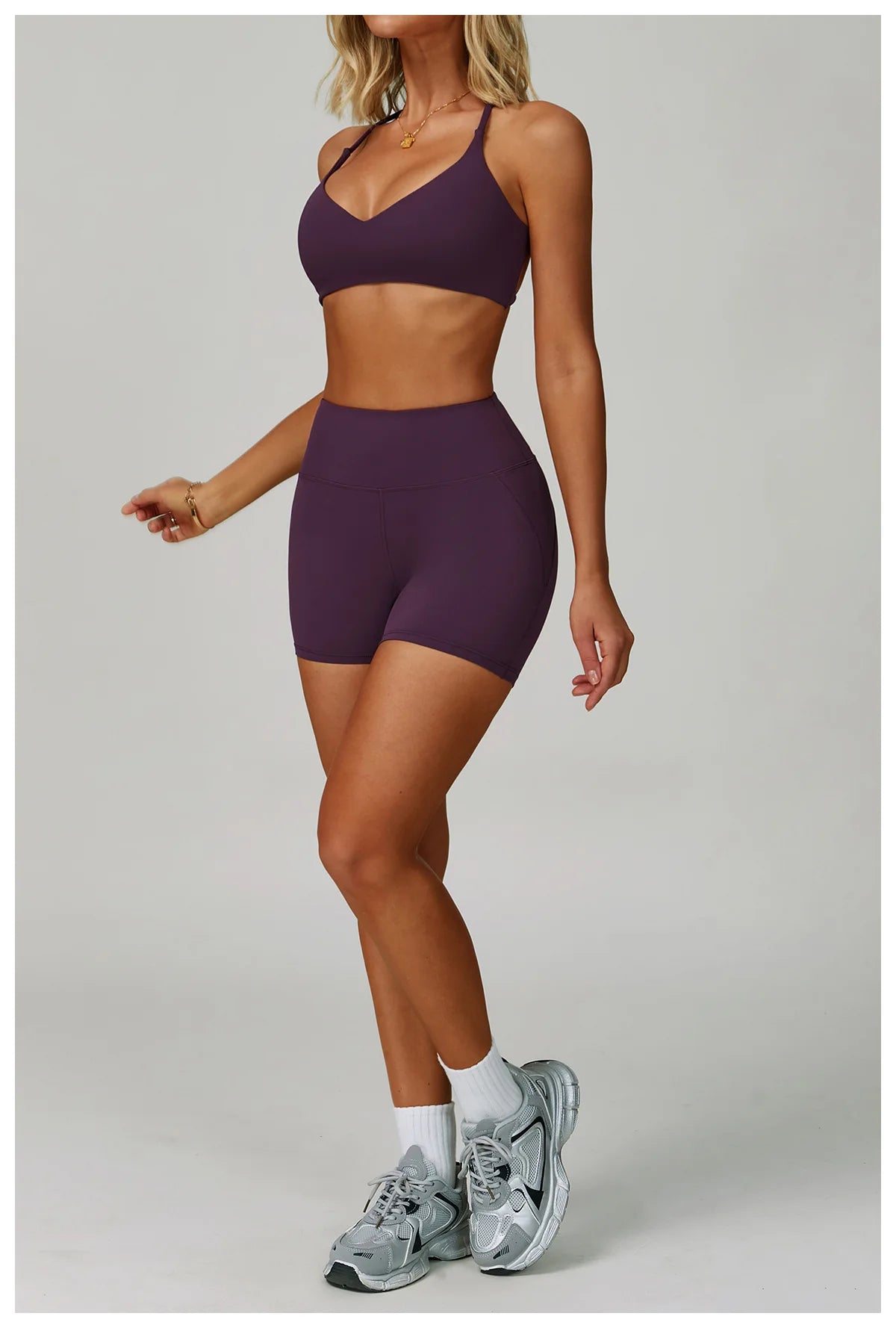 Two-piece women's fitness tracksuit from The Clothing Company Sydney, featuring a workout bra and high-waist leggings for yoga and gym activities.