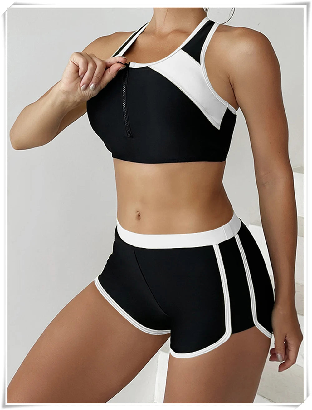 Two-piece swimsuit with zipper tankini top and high-waist shorts, perfect for summer beachwear and swimming by The Clothing Company Sydney.