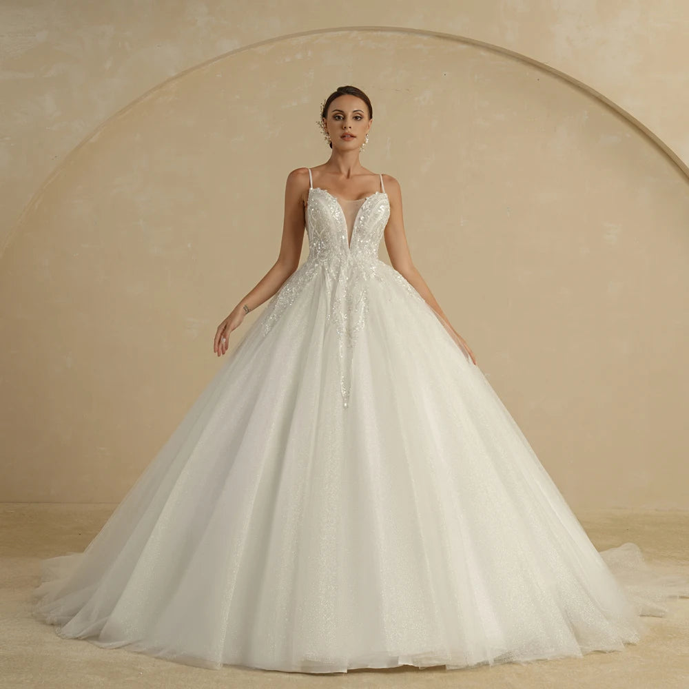 Ivory strapless A-line wedding dress with glitter accents and off-the-shoulder design, from The Clothing Company Sydney.