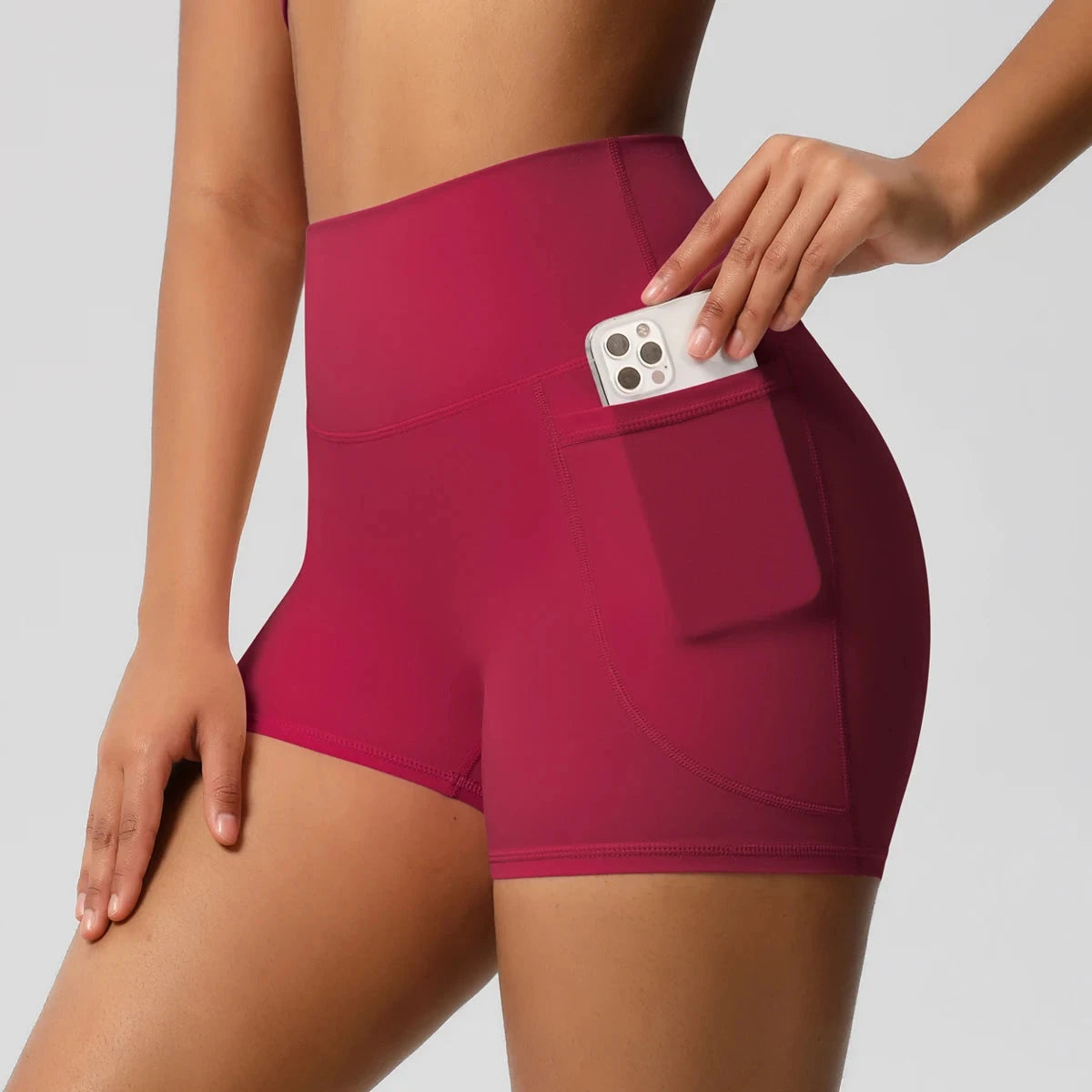 High-waisted bicycle yoga pants with pockets from The Clothing Company Sydney, quick-drying, breathable workout shorts for women.