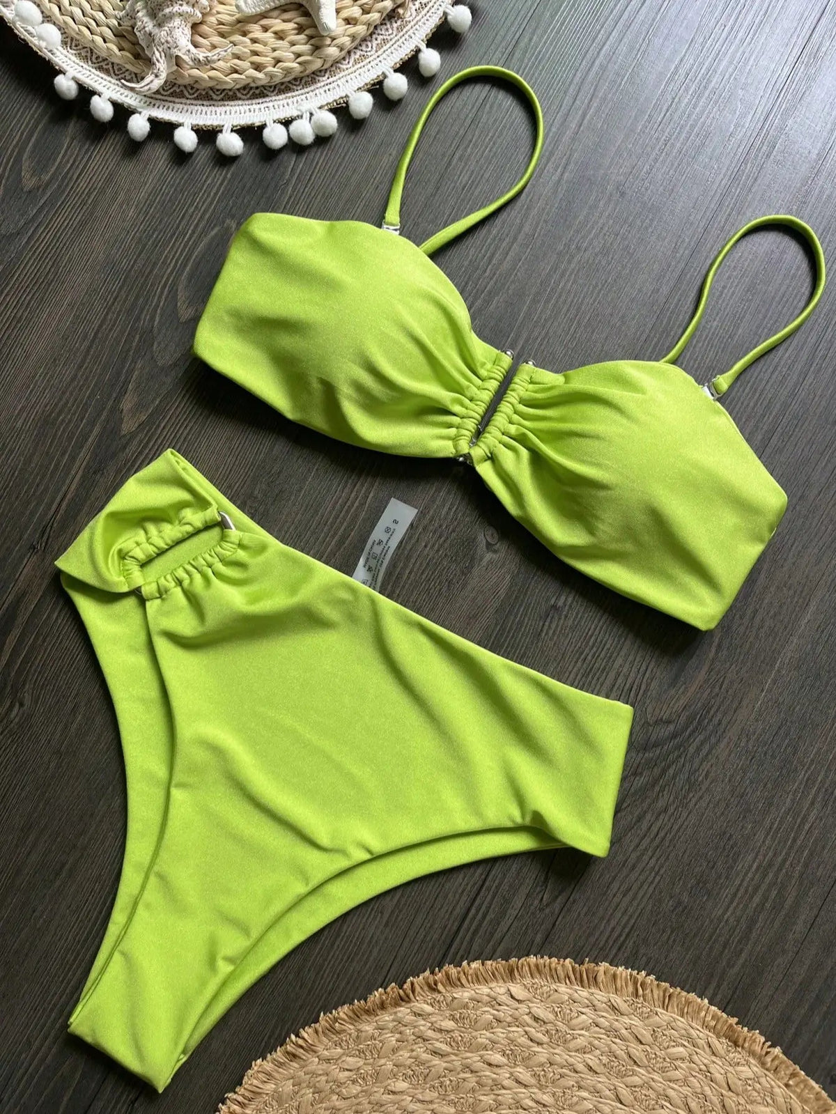 Two-piece bandeau bikini set with push-up design from The Clothing Company Sydney, featuring solid color swimwear and thong bottoms.
