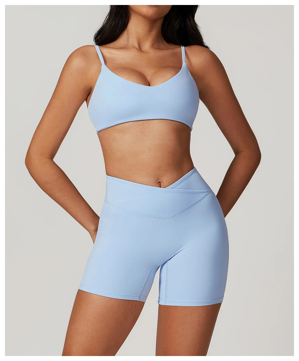 Two-piece women's fitness set with crop top, sports bra, and leggings from The Clothing Company Sydney, ideal for yoga and gym workouts.