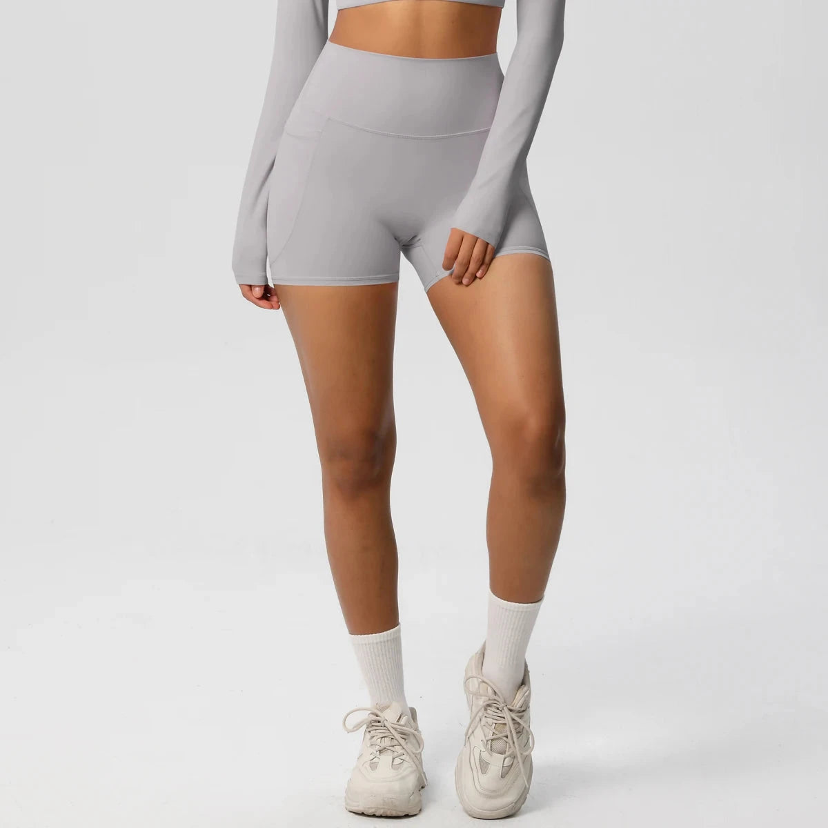 High-waisted bicycle yoga shorts with pockets, quick-drying breathable fabric, designed for women’s workout and fitness activities.