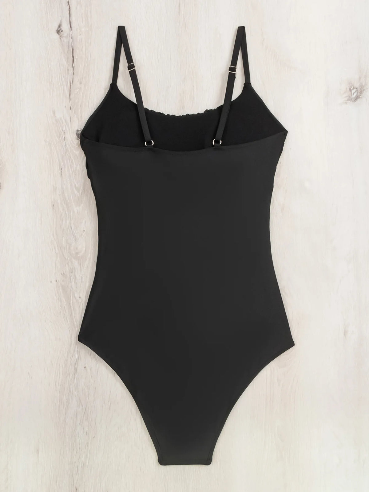 Black one-piece swimsuit from The Clothing Company Sydney, stylish monokini beachwear for swimming and lounging at the beach.