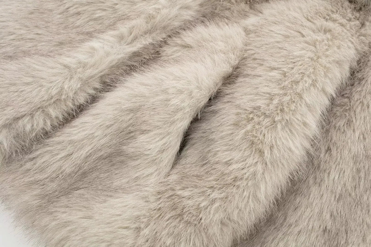 Women's cropped faux fur jacket from The Clothing Company Sydney with long sleeves, snap buttons, chic lapel collar, and thick outerwear.