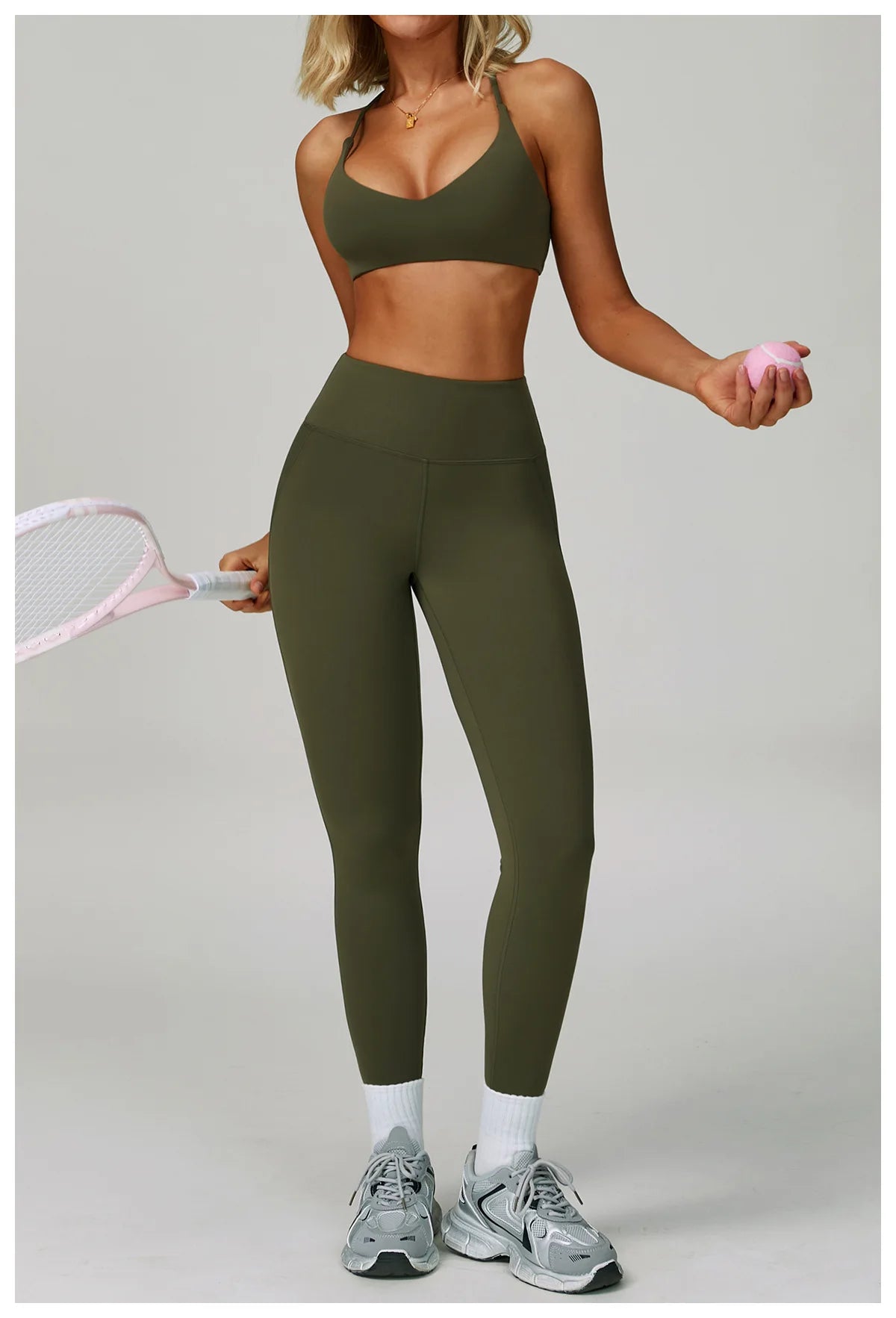 Women’s fitness tracksuit set by The Clothing Company Sydney featuring high-waist leggings and a sports bra for workout and yoga.