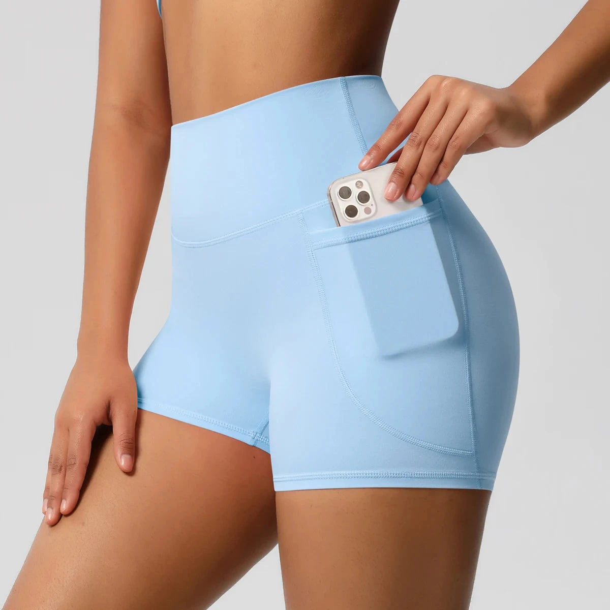 High-waisted bicycle yoga pants by The Clothing Company Sydney with pockets, quick-drying, breathable fabric, suitable for workout and fitness.