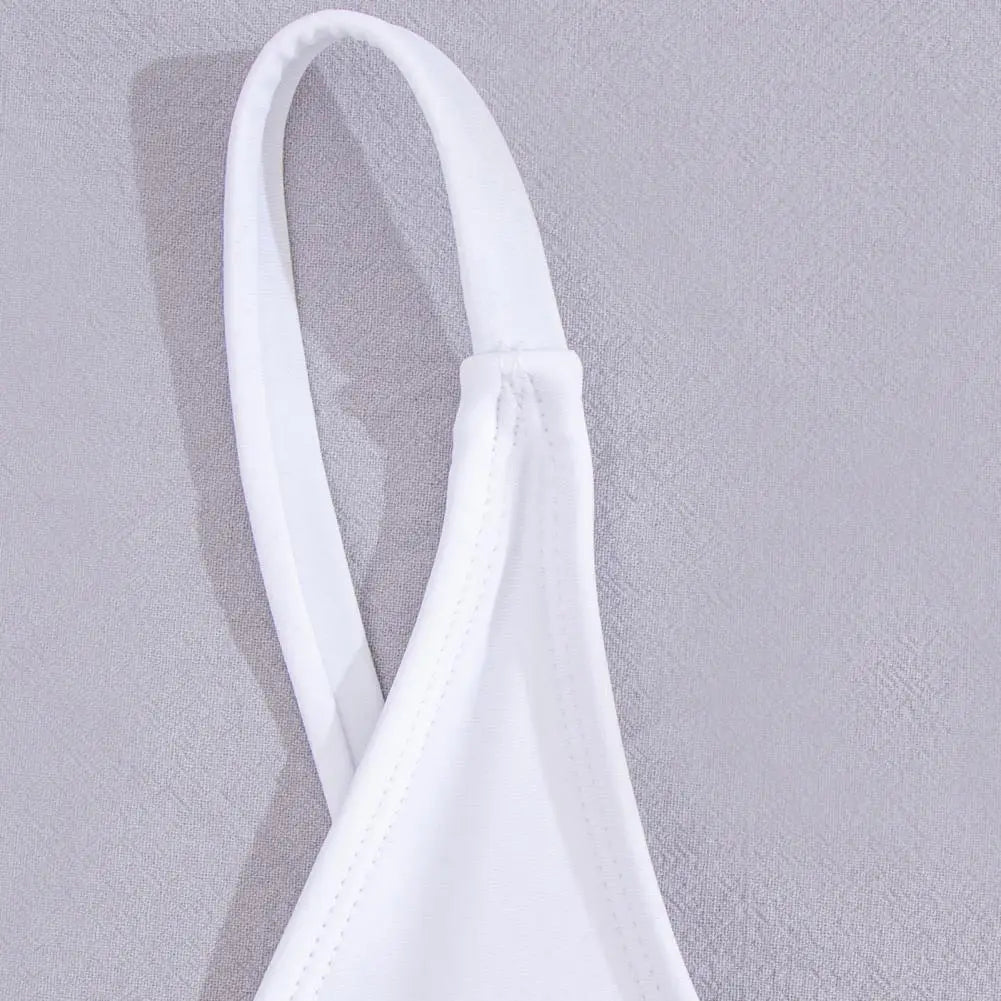 Backless micro thong one-piece swimsuit for women by The Clothing Company Sydney, featuring minimal coverage and sleek design.