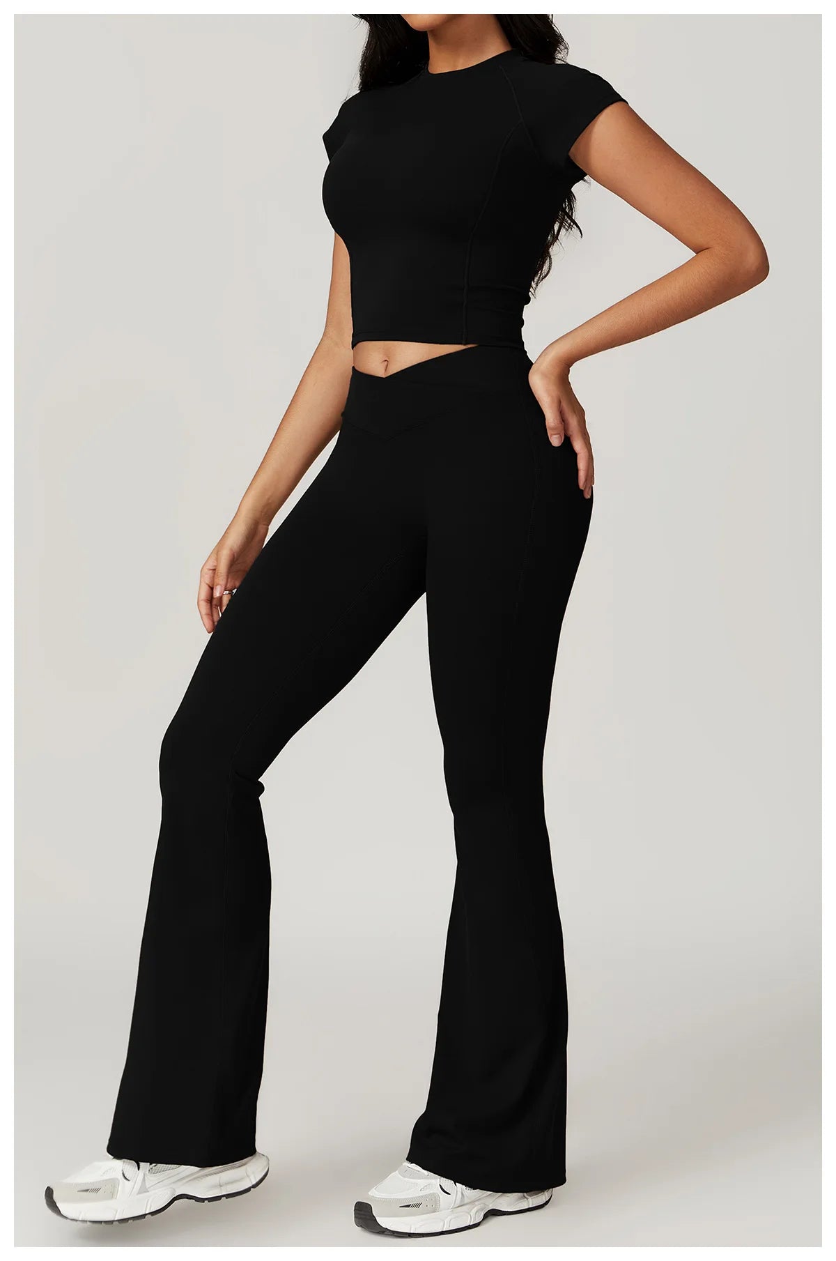 Two-piece women's yoga gym set including a short sleeve crop top, sports bra, and leggings from The Clothing Company Sydney.