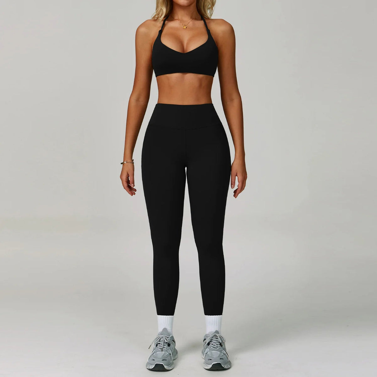 Women's fitness tracksuit set by The Clothing Company Sydney with high waist leggings and sports bra, ideal for yoga and workouts.