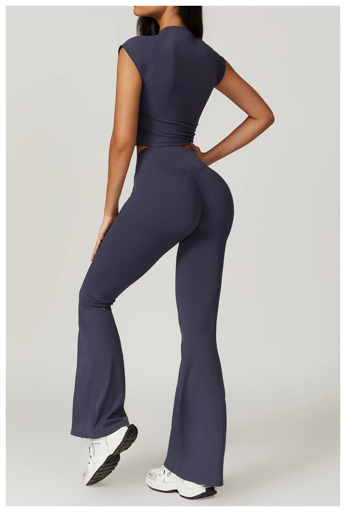 Two-piece women's fitness set including a short sleeve crop top, sports bra, and leggings from The Clothing Company Sydney.