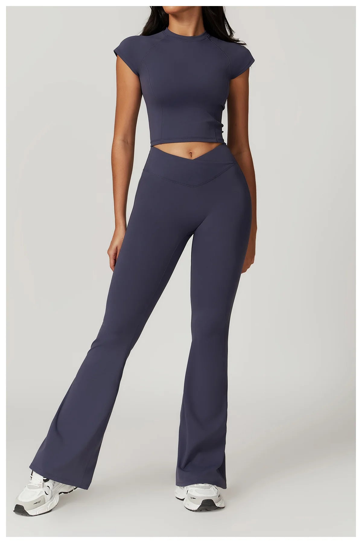 Two-piece women's fitness set with crop top, sports bra, and leggings from The Clothing Company Sydney for yoga and gym workouts.