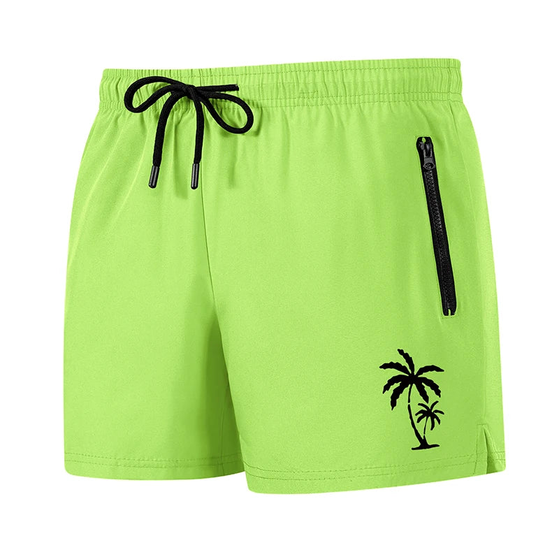 Men's palm tree print board shorts from The Clothing Company Sydney, quick-dry swim trunks with zipper pockets and beach mesh liner.