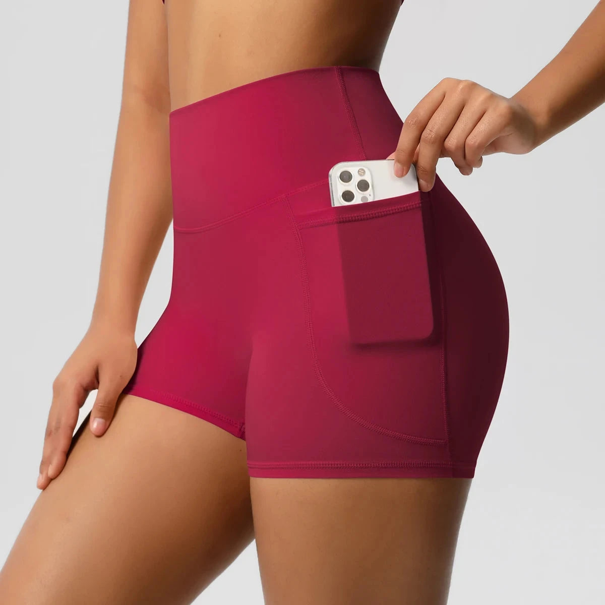 High-waisted bicycle yoga shorts by The Clothing Company Sydney with pockets, quick-drying, breathable fabric, suitable for workout and fitness.