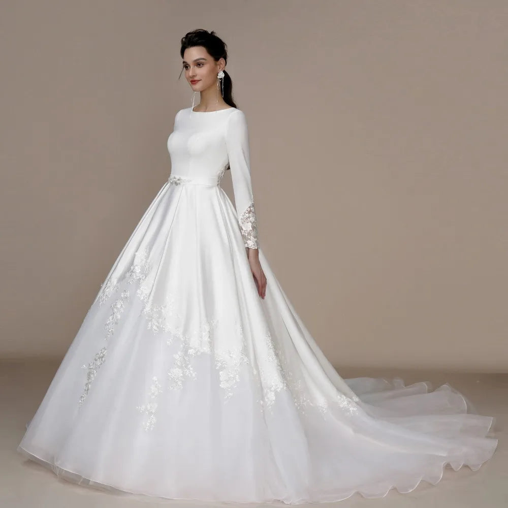 Ivory strapless A-line wedding dress with glitter and off-the-shoulder design by The Clothing Company Sydney, bridal gown with bling details.