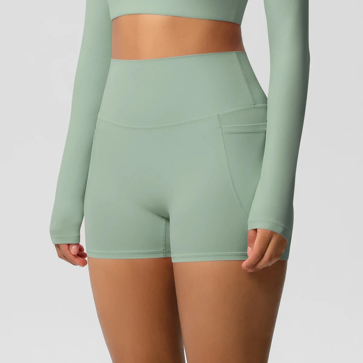 High-waisted bicycle yoga pants by The Clothing Company Sydney with pockets, quick-drying, breathable fabric for women’s workout fitness.