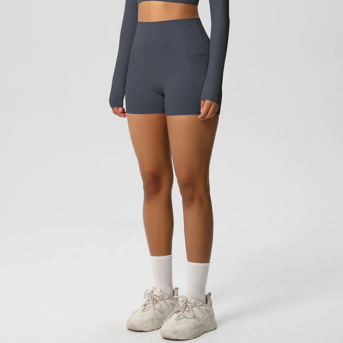 High-waisted bicycle yoga shorts by The Clothing Company Sydney, quick-drying, breathable workout pants with pockets for women.