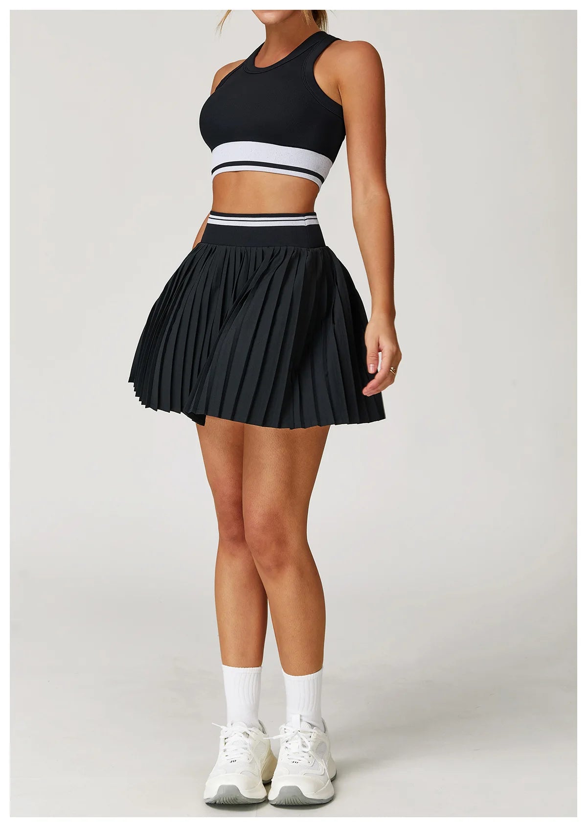 Two-piece women's yoga and fitness suit with sports top and running shorts skirt, athletic wear by The Clothing Company Sydney.