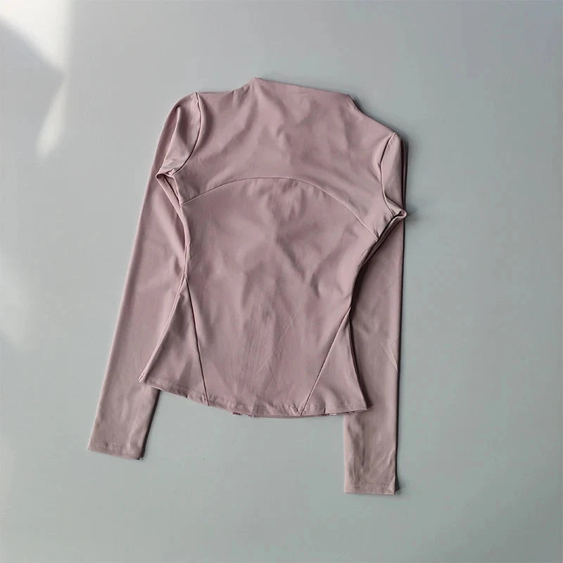 Women’s zip fitness jacket by The Clothing Company Sydney, long sleeve activewear top for yoga, running, and gym workouts.