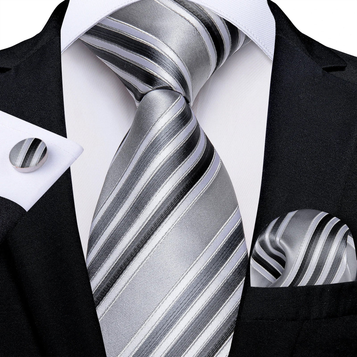 Men's gray paisley silk tie set with wedding tie, pocket square, and cufflinks, featuring elegant floral patterns and accessories.