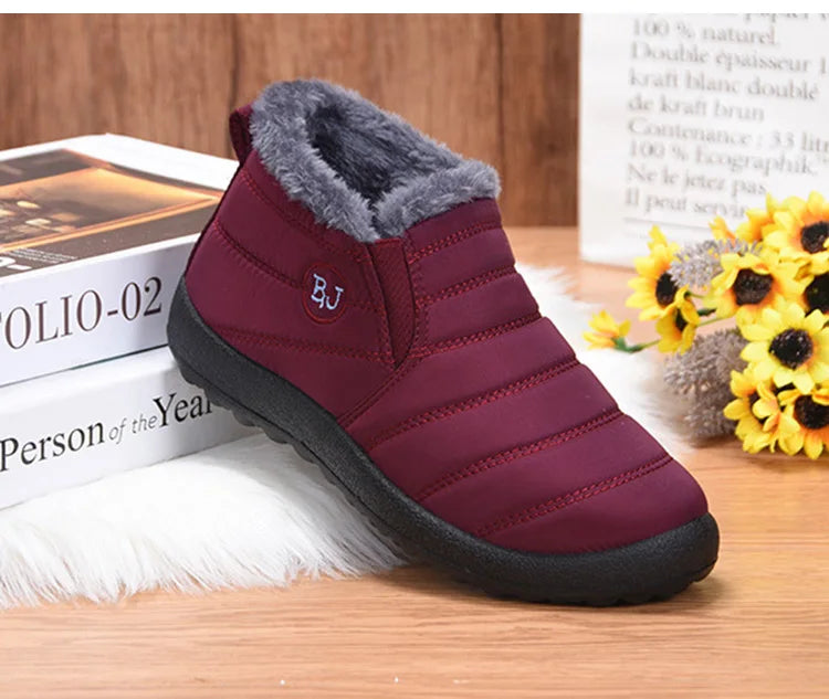 Women’s waterproof fur snow boots by The Clothing Company Sydney, slip-on ankle footwear with cozy fur lining and rugged soles.