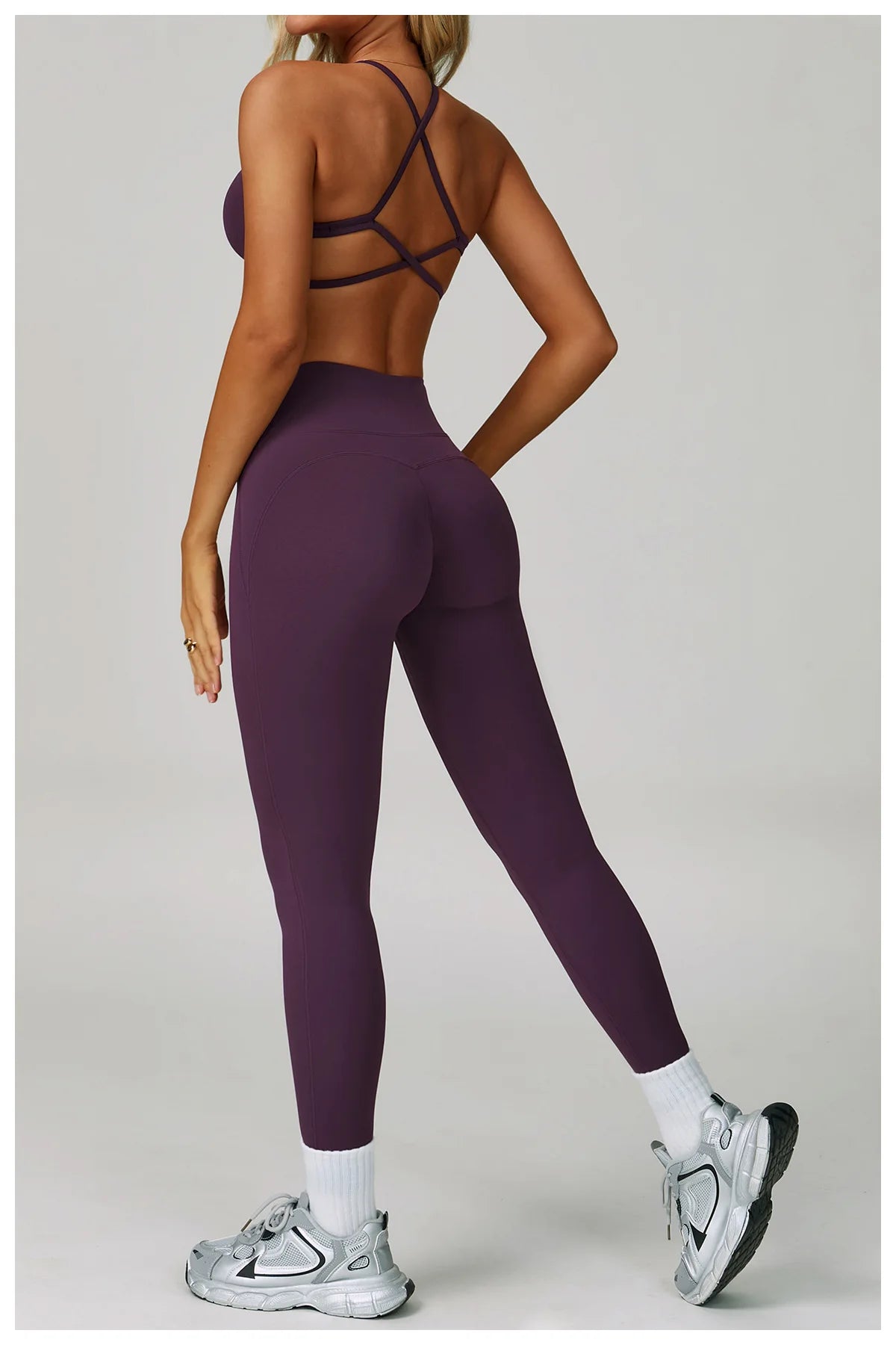Women's fitness tracksuit set by The Clothing Company Sydney, including high-waist leggings and sports bra for yoga and workout activities.