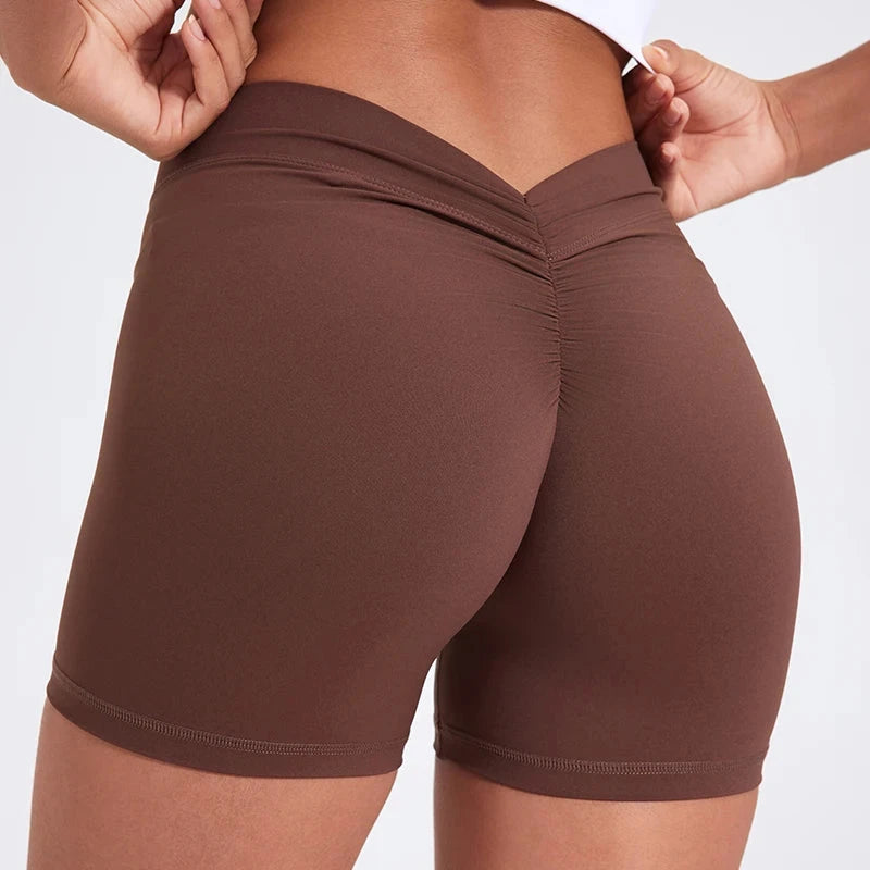 High-waisted V-back yoga shorts by The Clothing Company Sydney, form-fitting nylon fitness shorts for training and sports.