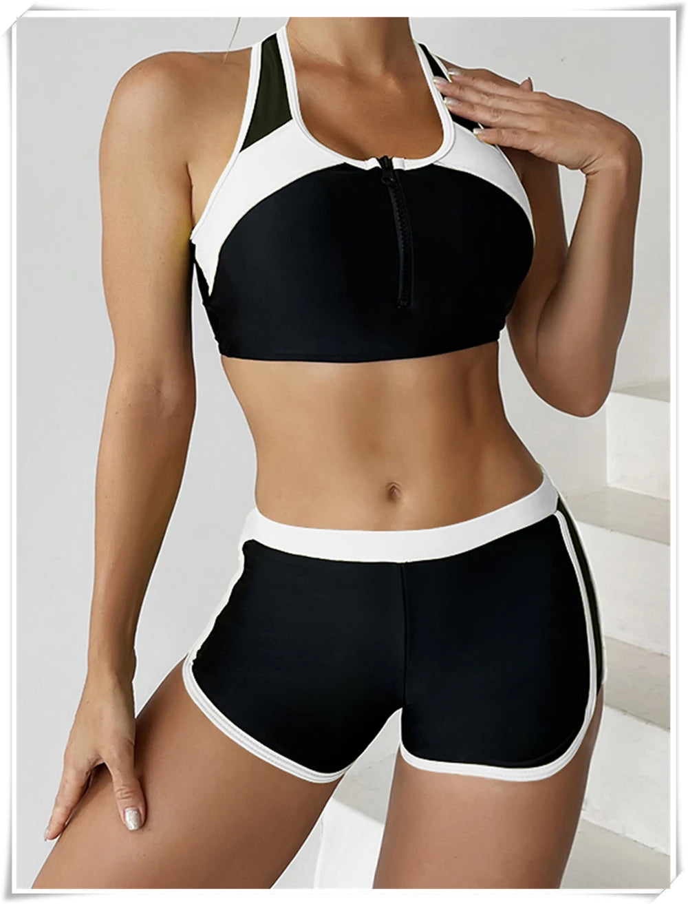 Two-piece swimsuit from The Clothing Company Sydney featuring a zipper tankini top and high-waist shorts for summer beachwear.