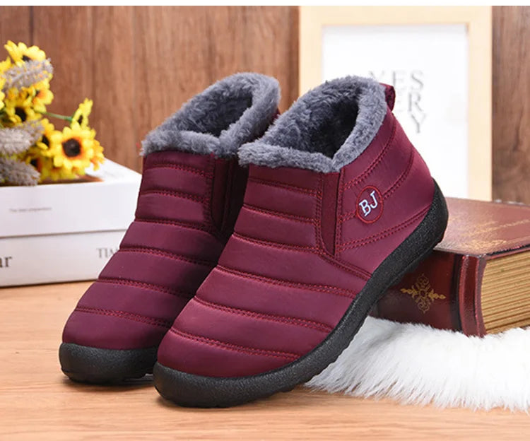 Women’s waterproof fur snow boots by The Clothing Company Sydney, slip-on ankle footwear with warm lining and durable sole.