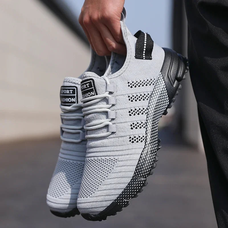 Men's casual sneakers by The Clothing Company Sydney featuring breathable mesh, lightweight design, soft sole, slip-on loafers, and trainers.