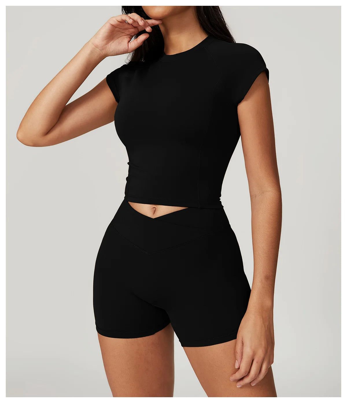 Two-piece women's yoga and fitness set including a crop top, sports bra, leggings, and bike shorts from The Clothing Company Sydney.