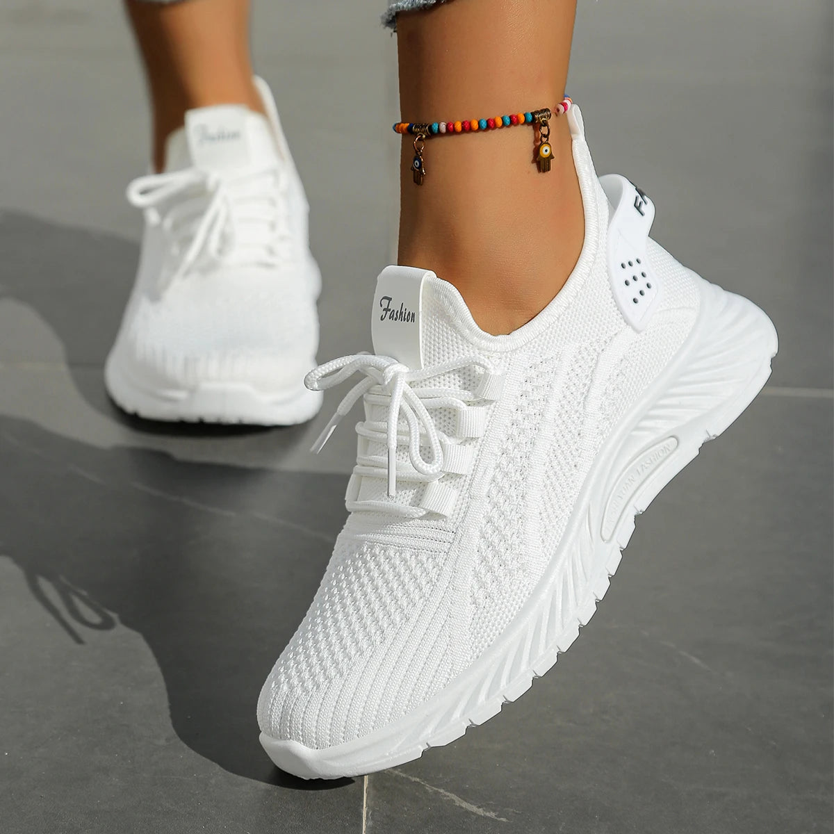 Women's fall casual sneakers by The Clothing Company Sydney featuring fly weave material and lace-up design.