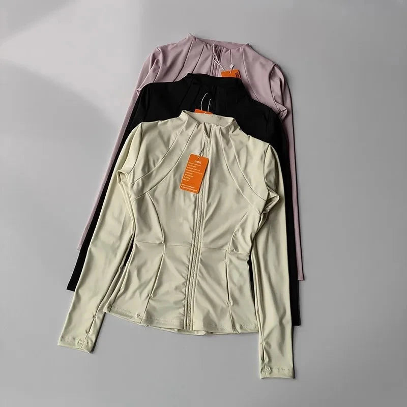 Women’s slim-fit fitness sports jacket by The Clothing Company Sydney, long sleeve zip-up yoga and workout top in warm, activewear style.