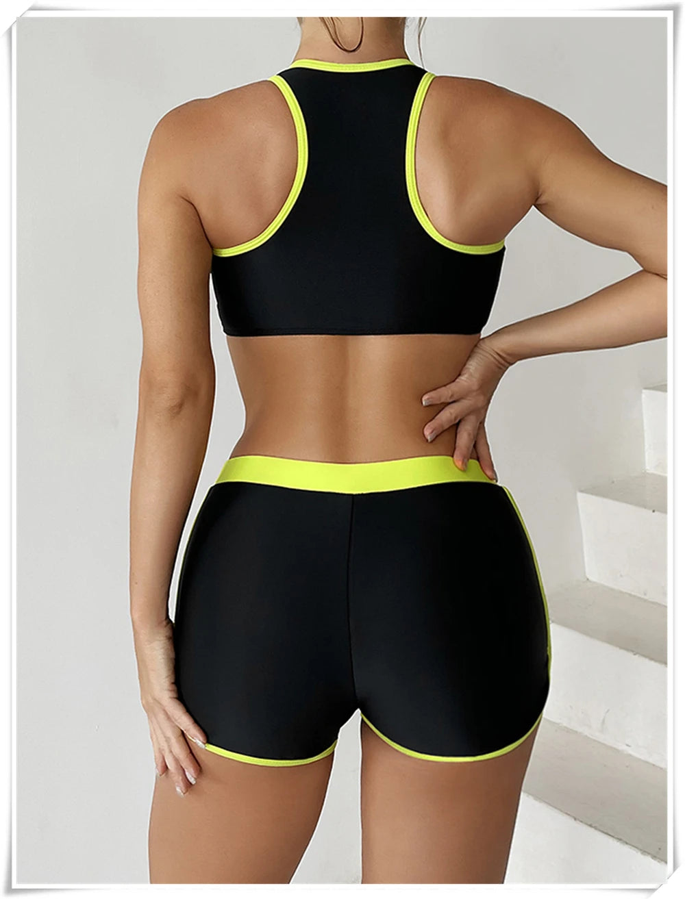 Two-piece swimsuit by The Clothing Company Sydney featuring a zipper tankini top and high-waist shorts for summer beachwear