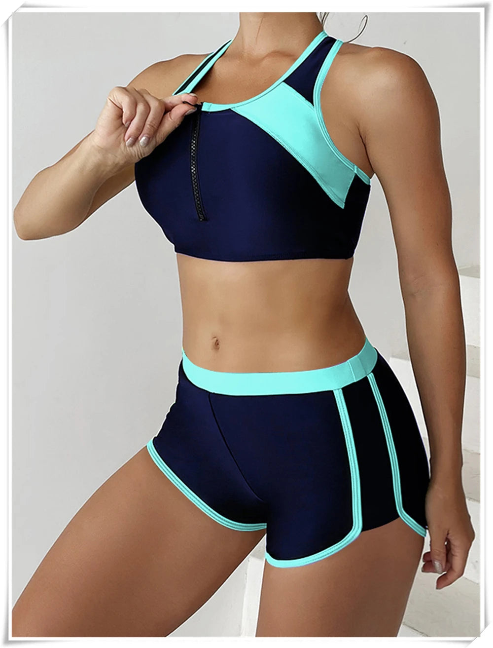 Two-piece swimsuit set by The Clothing Company Sydney featuring a zipper tankini top and high-waist swim shorts, perfect for summer beachwear.